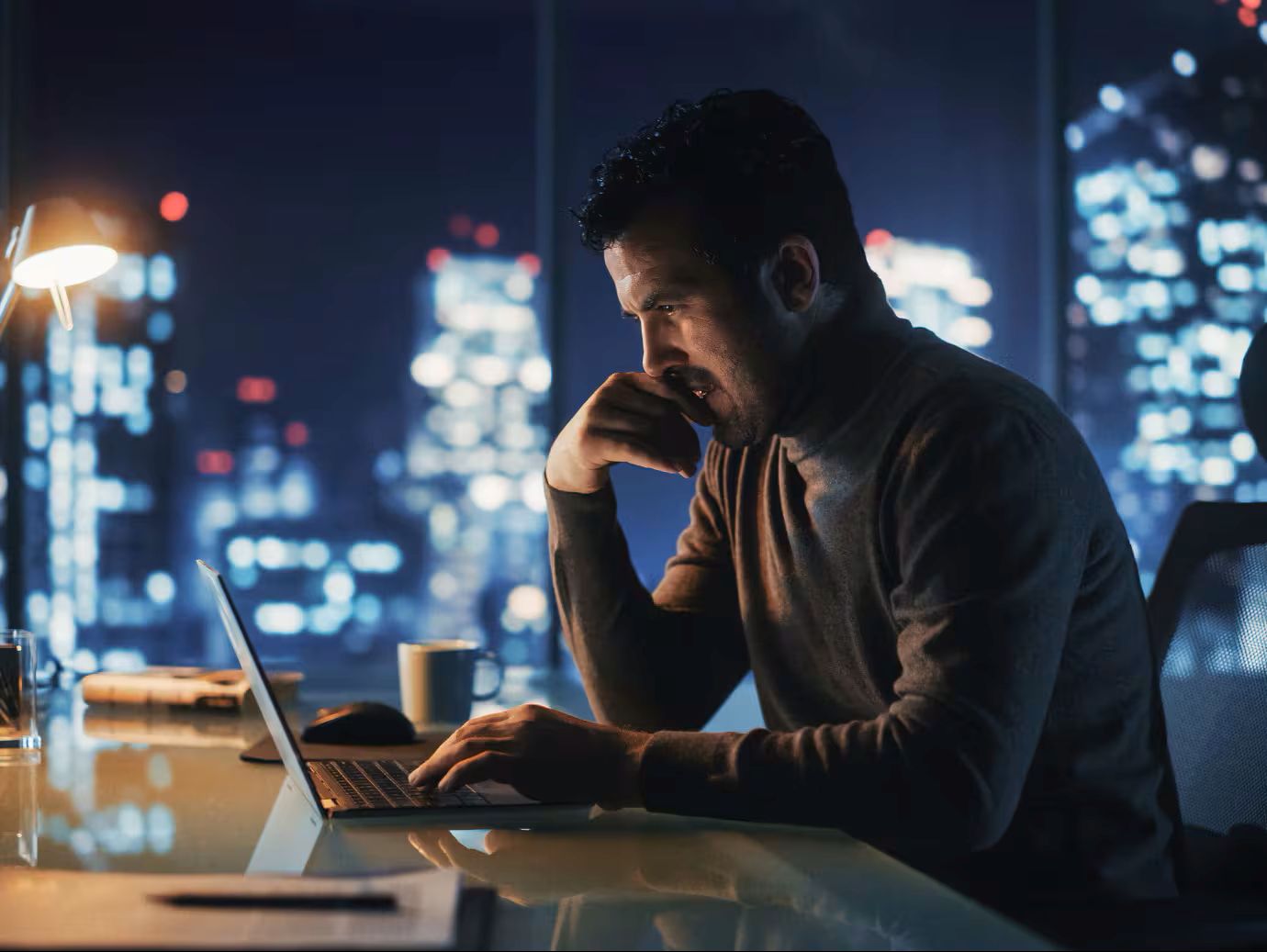 person sitting at desk and studying