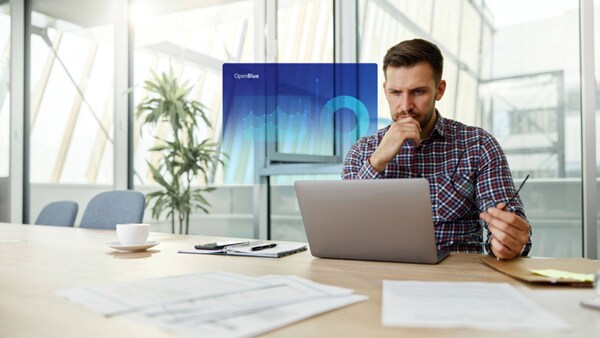 A hologram of a OpenBlue graphic of person person looking into this laptop