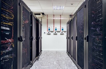 Inside a data center with data server racks on either side